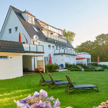Garten am Haus Storchennest – ruhige Ferienwohnung auf Norderney